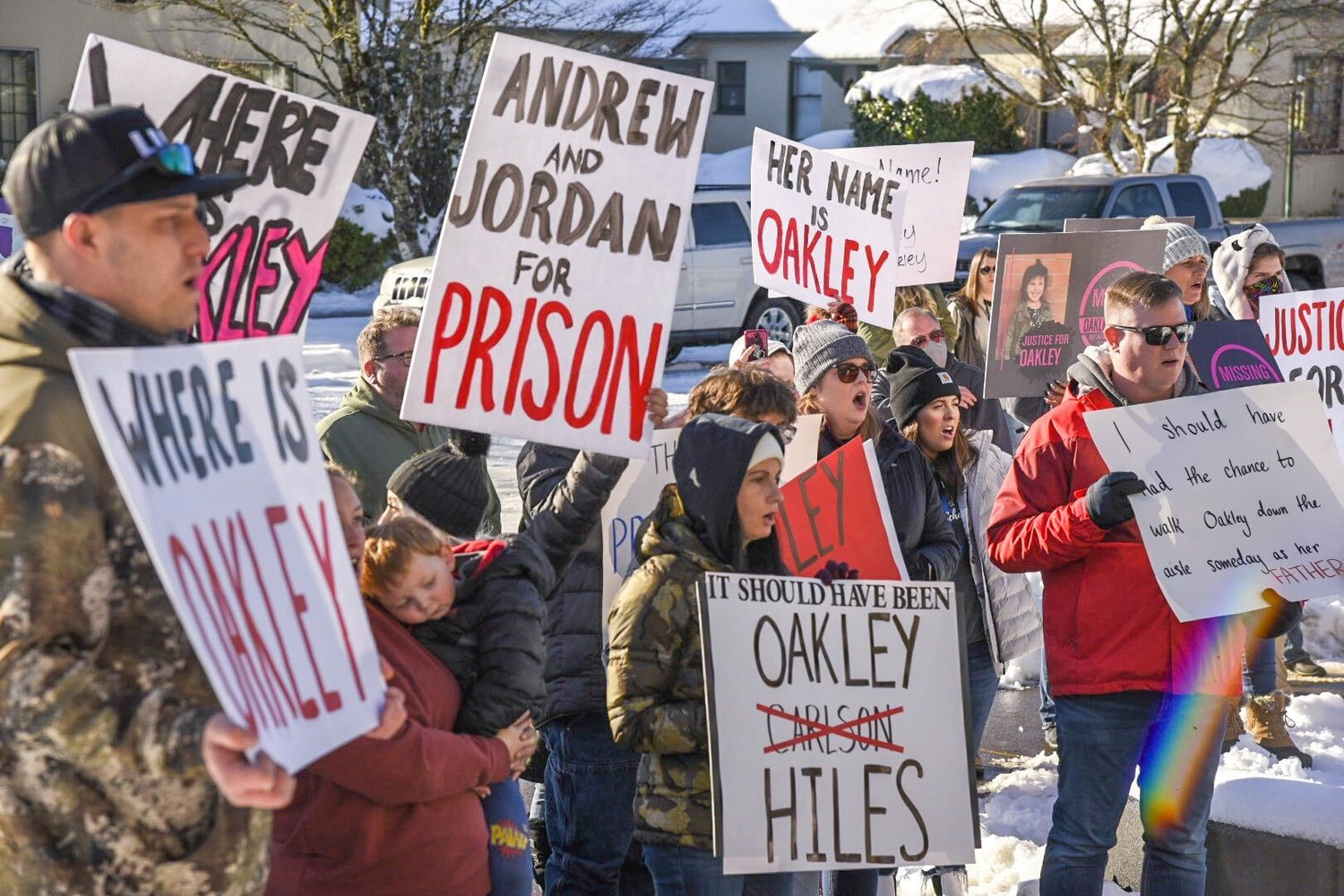 Demonstrators gather outside the Grays Harbor County Courthouse on Thursday morning in support of missing girl Oakley Carlson.